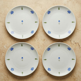 The Solitude Dinner Plate, 26cm — set of 4 flatlay with single cobalt motif at centre