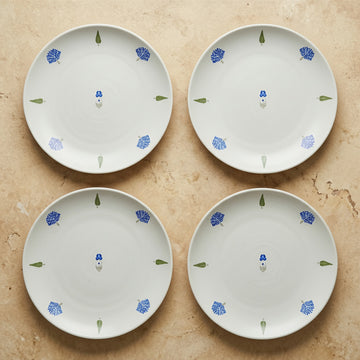 The Solitude Dinner Plate, 26cm — set of 4 flatlay with single cobalt motif at centre