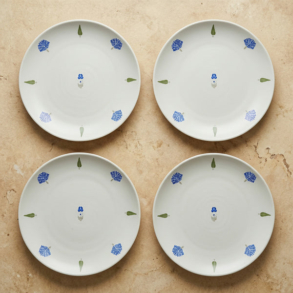 The Solitude Dinner Plate, 26cm — set of 4 flatlay with single cobalt motif at centre