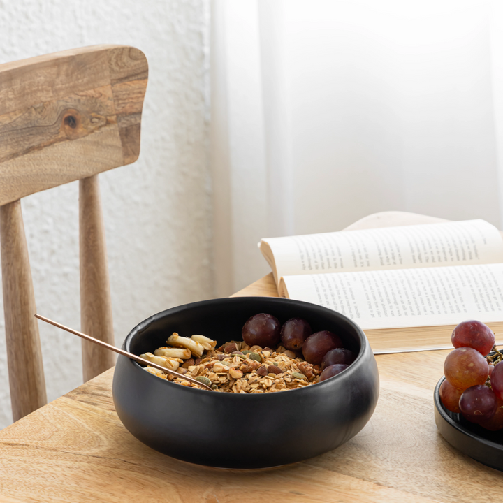 1L black round ceramic bowl, artisan-made and microwave safe, perfect for everyday meals.