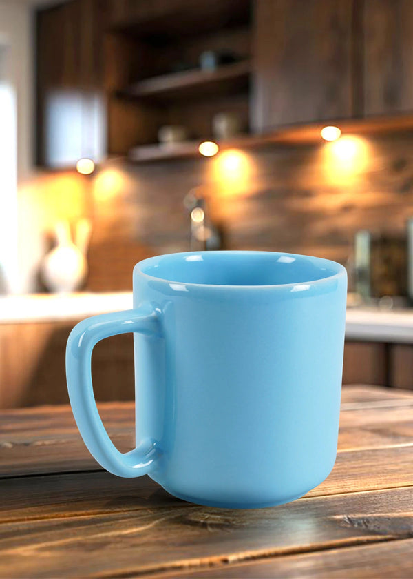 Blue mug on a wooden surface with a kitchen background