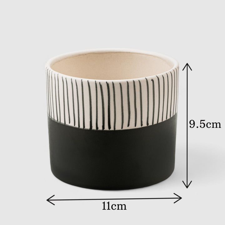 Enhance your indoor space with the Stripe Hype, a handcrafted ceramic planter boasting a modern two-tone design, perfect for small plants or herbs, among our top indoor planters.