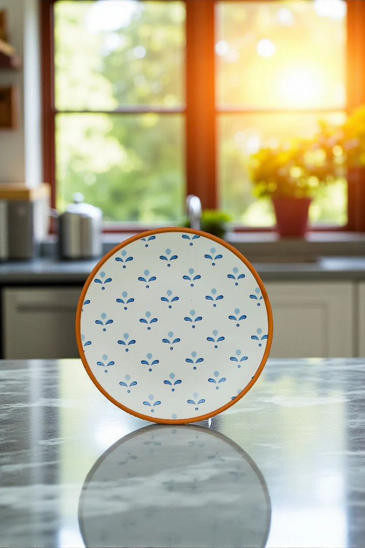 Decorative plate with floral pattern on a kitchen counter
