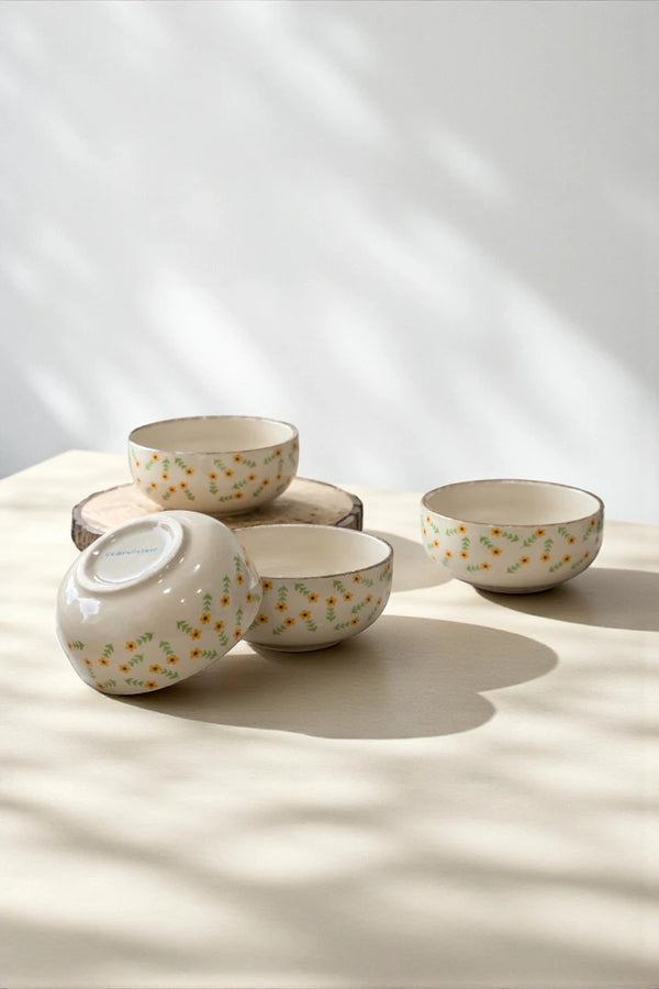 Artistic shot of Golden Dawn ceramic decorative bowls with dramatic shadows, highlighting their beauty as premium, artisanal home decor pieces for a sophisticated home.