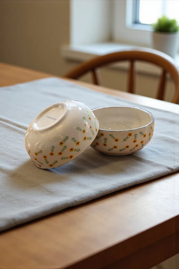 Two Golden Dawn luxury ceramic bowls arranged as elegant ceramic dinnerware on a dining table, perfect for everyday meals or special occasions.