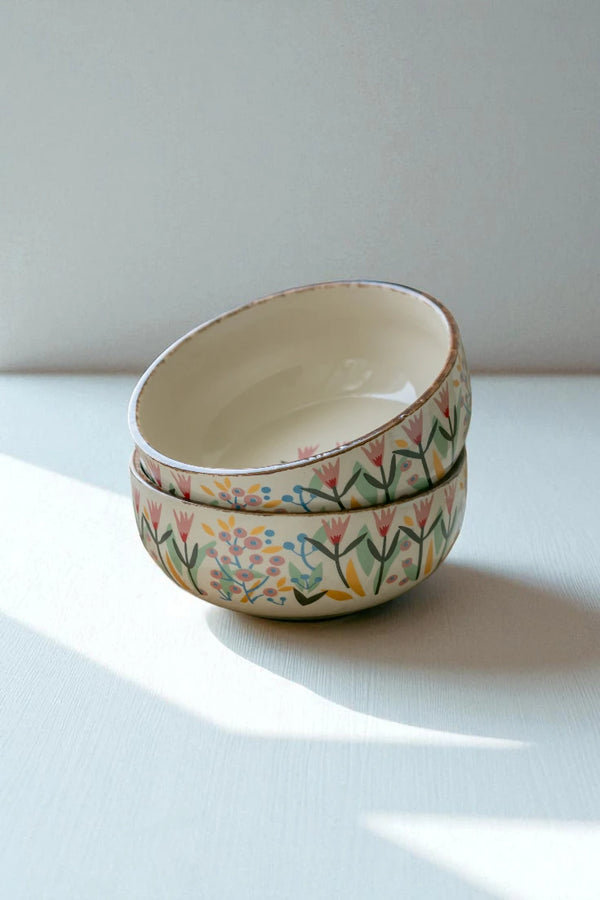 "Pink Dawn Bowl Set": luxury ceramic 500ml bowls online (Set of 2) featuring delicate pink flowers. Shop online for this artisan set – their elegant form makes them stunning bowls for a unique and artisan table decor, all from Claymistry.