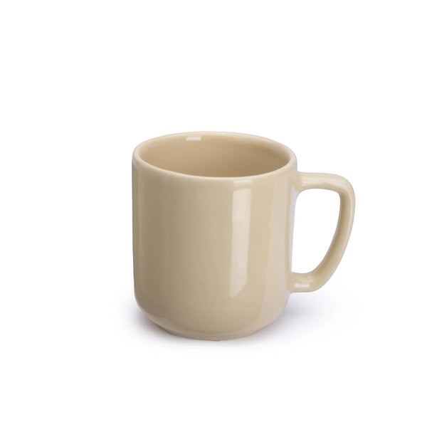 Beige ceramic mug on a white background