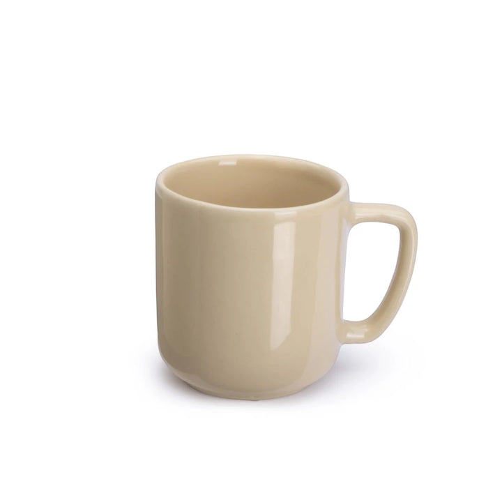Beige ceramic mug on a white background