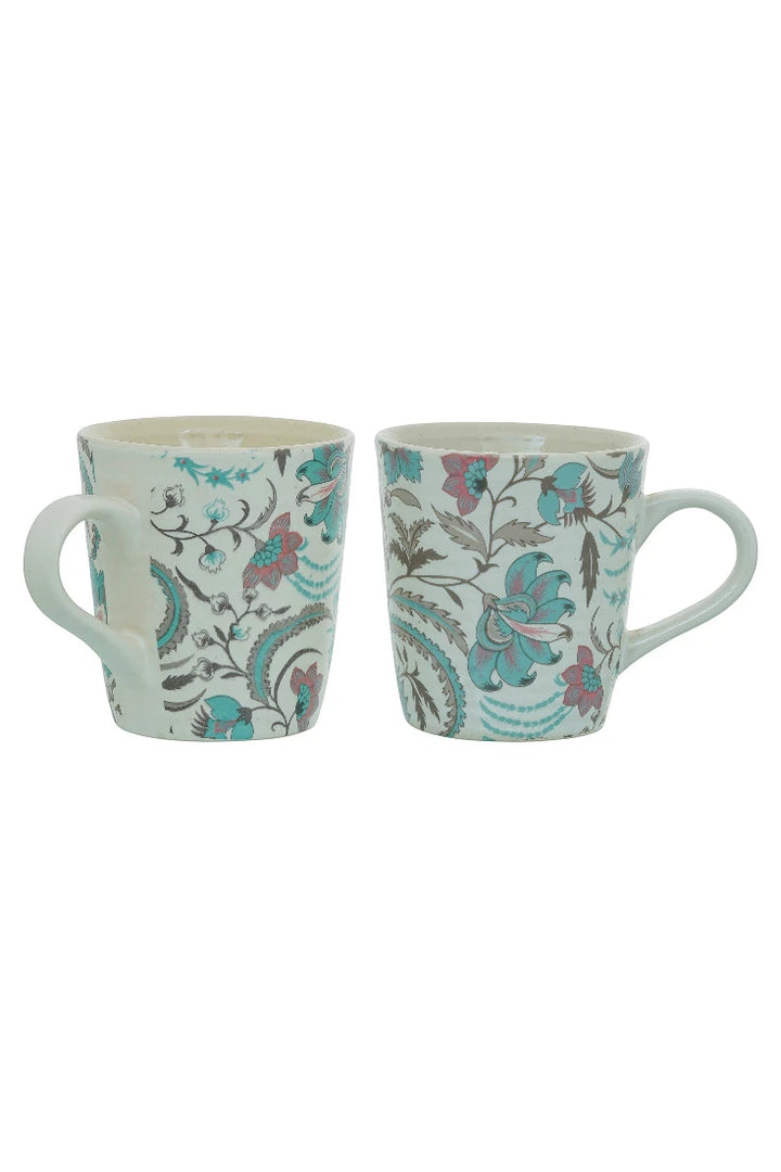 Two floral-patterned mugs on a white background