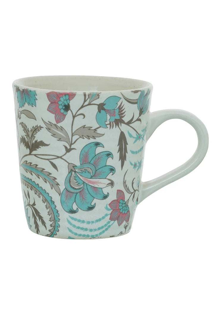 Mug with floral and paisley design on a white background