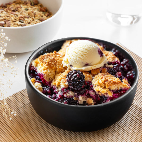 1L black ceramic serving bowl, handmade and non-toxic with a sleek glazed finish for modern dining.