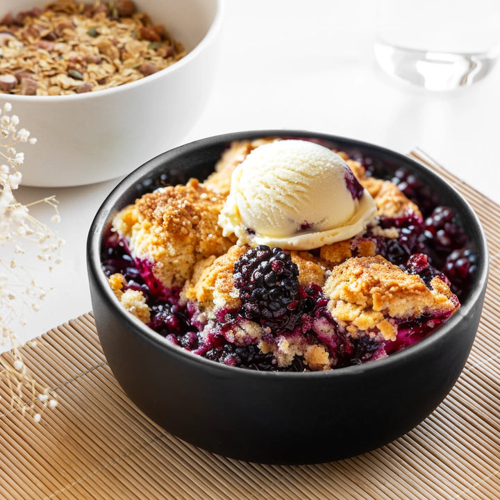 1L black ceramic serving bowl, handmade and non-toxic with a sleek glazed finish for modern dining.