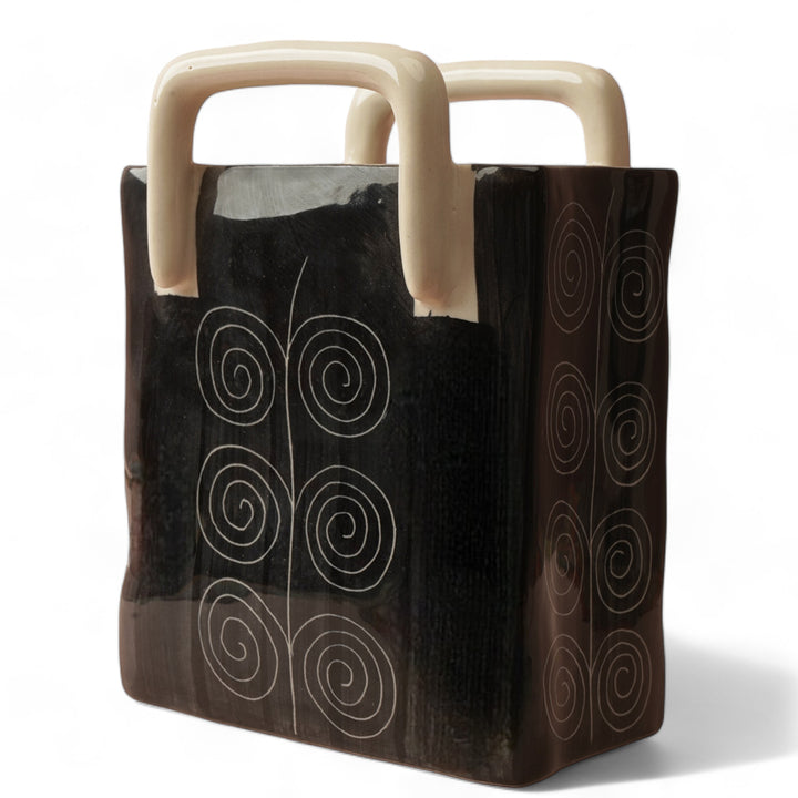 Beautiful black ceramic storage basket with sand color handle, durable, stable and stylish.