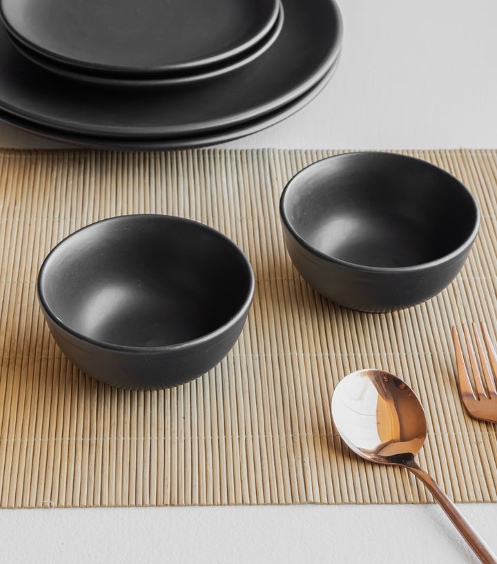 Handcrafted black glaze ceramic dinnerware set, safe, durable, and ideal for modern home dining.