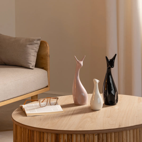 Beautiful ceramic deer figurine set in pink, black, and white with glazed finish for home decor.