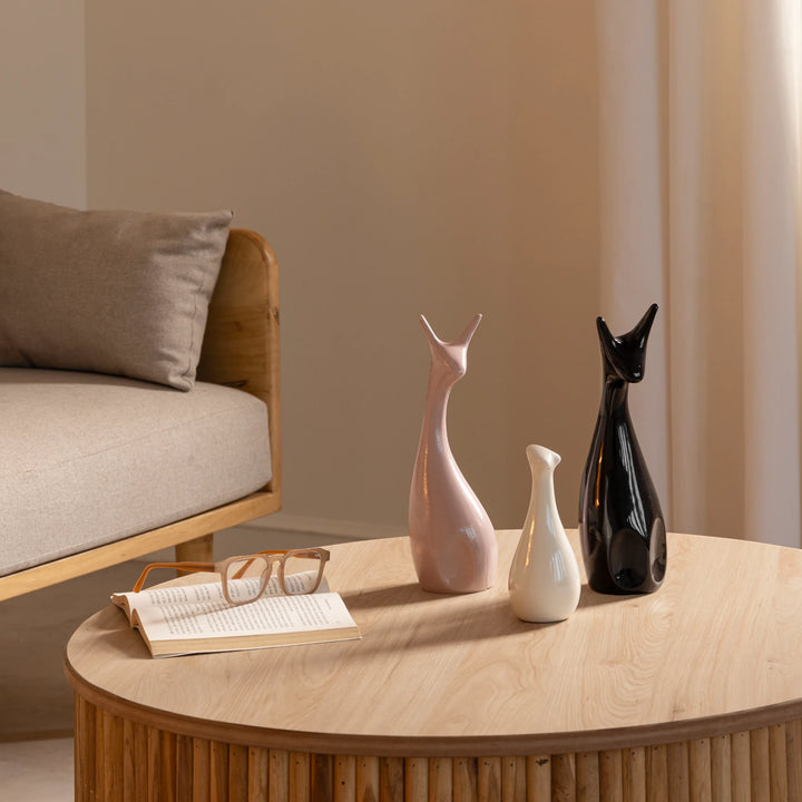 Beautiful ceramic deer figurine set in pink, black, and white with glazed finish for home decor.