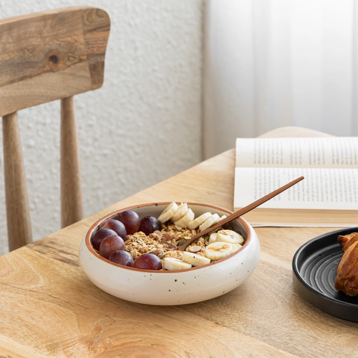 Elegant 500ml ceramic serving bowl in beige with brown rim, non-toxic and handmade by artisans.