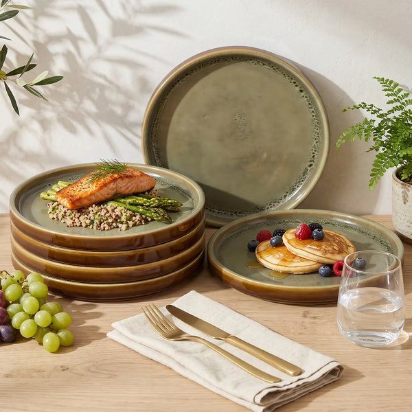 Grove ceramic dinner plate, sage green speckled with a warm brown rim