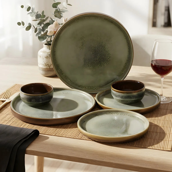Grove ceramic dinner set for two, six pieces in sage green with a warm brown rim