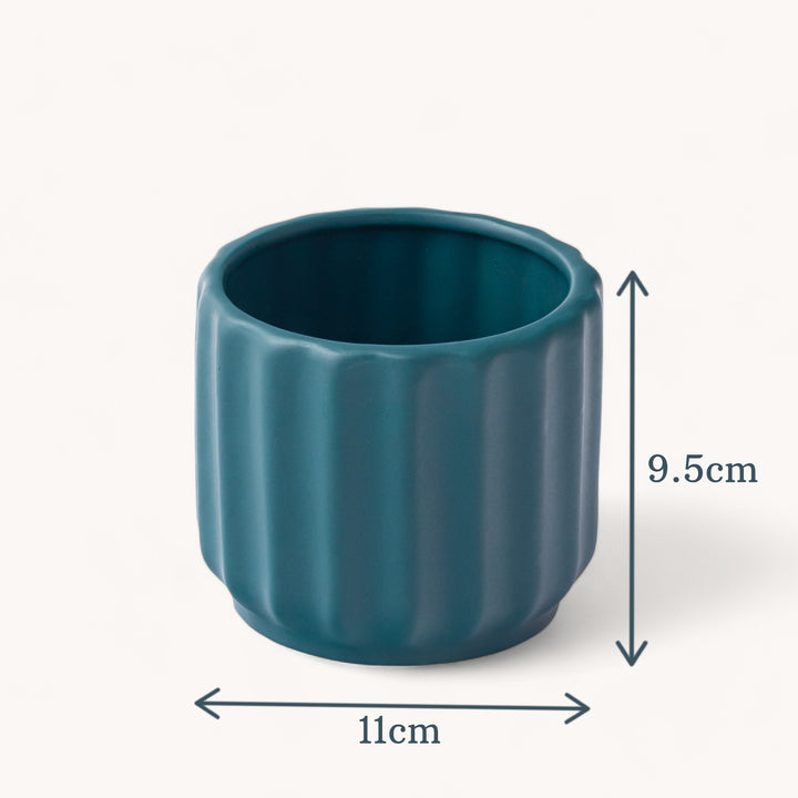 Handcrafted from high-quality ceramic, our Wave Whisperer planter is designed for indoor plants, bringing a whisper of style to your home decor with its intricate fluted design.
