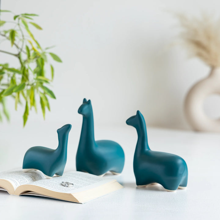 Cute sea green dinosaur family figurine set, perfect for coffee tables or charming kids’ decor.