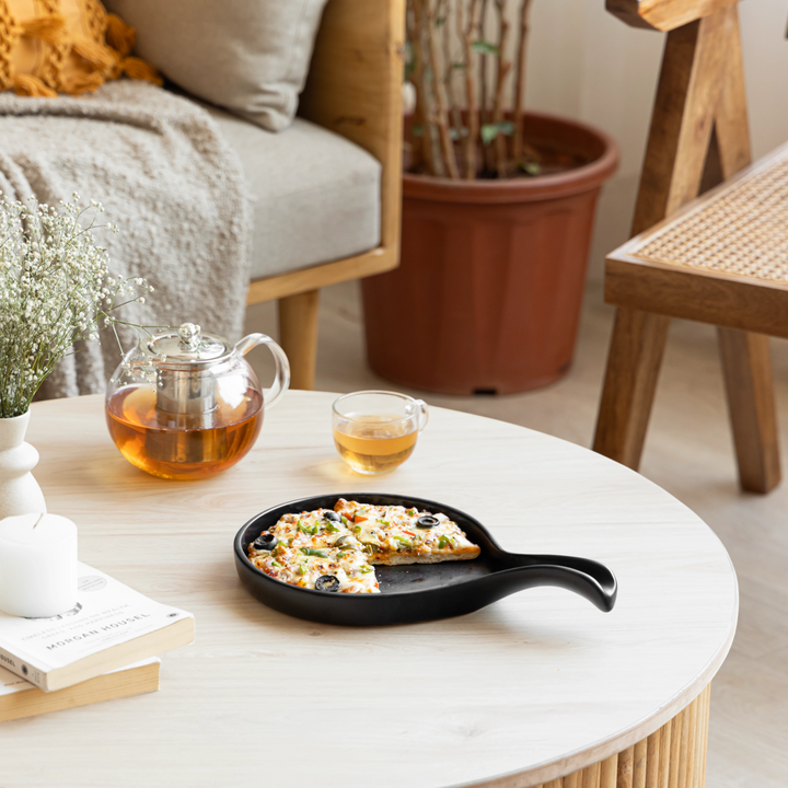 Elegant handmade black ceramic platter with elegant shape and finish for modern dining.