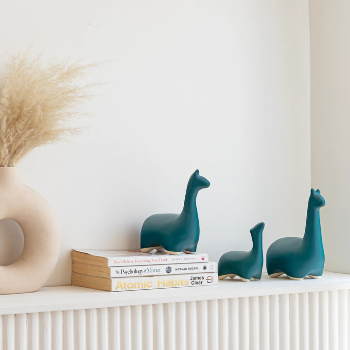 Beautiful trio of handmade sea green ceramic dino figurines, decorative for study or office.