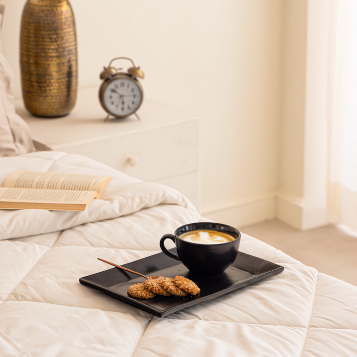 Pretty matte black ceramic trays with slanted edges, ideal for serving coffee, tea and drinks and decor styling.
