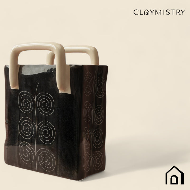 Non-slip black ceramic basket with food-safe finish, ideal for kitchen, living room or bath storage.