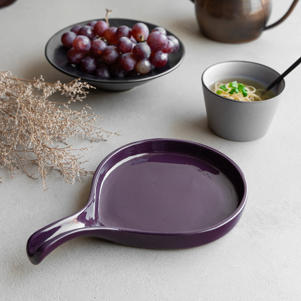 Stylish purple ceramic platter with handle, handmade and lead-free for elegant food presentation.