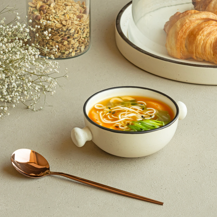 Beige ceramic bowls with brown rim, 280ml, artisan-crafted and lead-free for daily dining elegance.