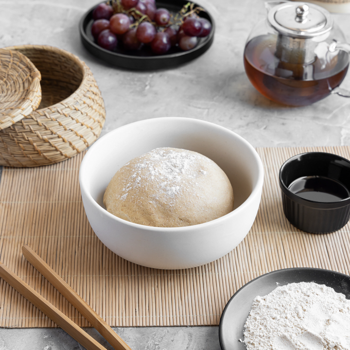 White 1L ceramic bowl for safe dining, round, glazed and handmade for versatile kitchen use.