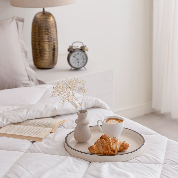 Speckled sand ceramic tray with black rim and glaze, eco-friendly and elegant for home use.
