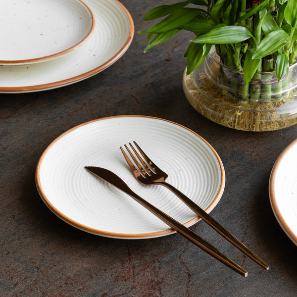 Handmade ceramic quarter plate in sand speckled glaze, non-toxic and perfect for safe daily use.