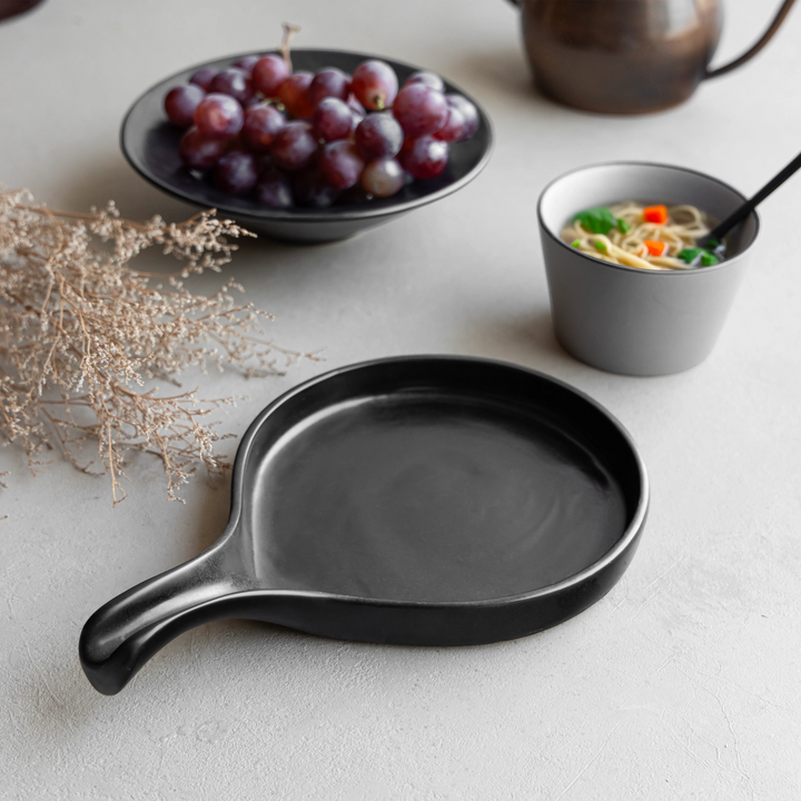 Beautiful black glazed ceramic platter, safe and bone ash-free for stylish dining at home.