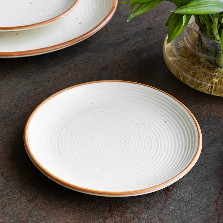 Handcrafted ceramic side plate in speckled sand, safe, microwave-friendly, and beautifully durable.