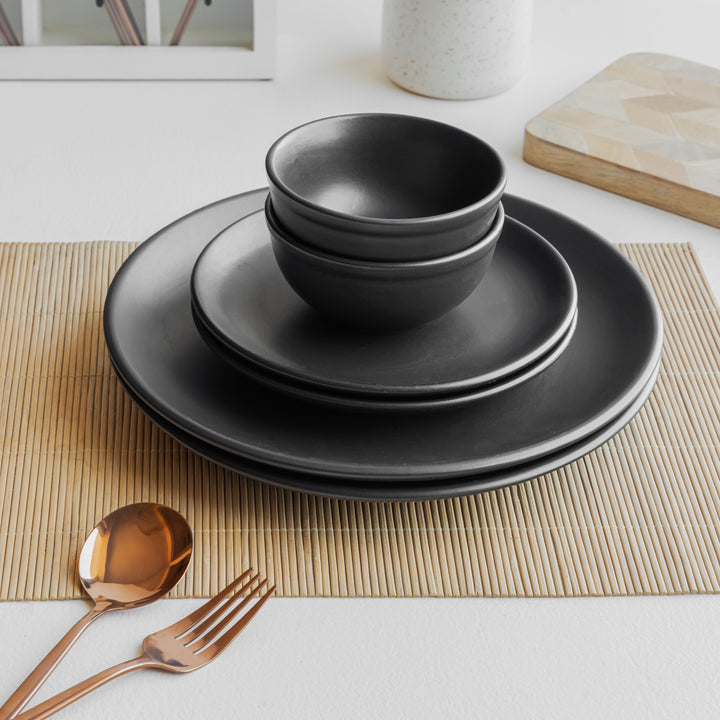 Sustainable black ceramic dinner set, handcrafted and safe for daily use with refined aesthetics