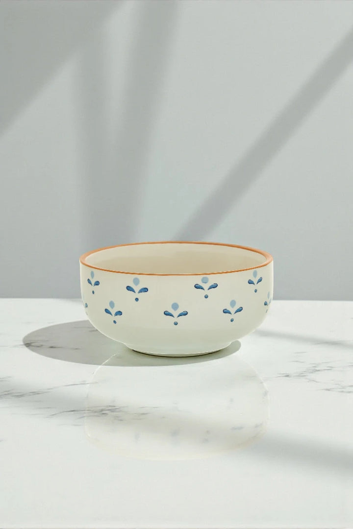 Ceramic bowl with floral pattern on a marble surface