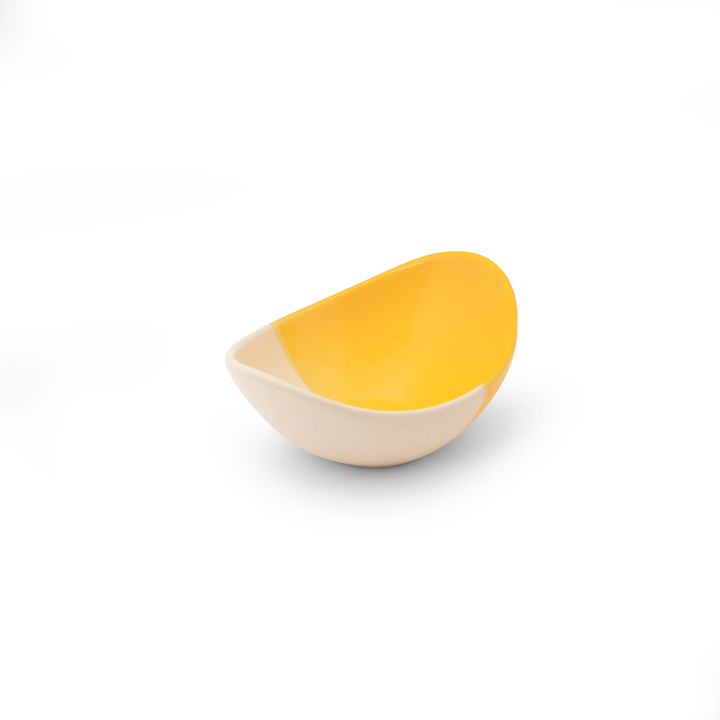 A modern, curved ceramic dessert bowl 